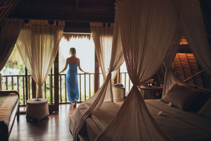 Woman Standing In A Balcony And Enjoying The View 