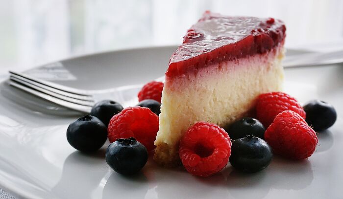 A Slice Of Cheesecake And Berries 