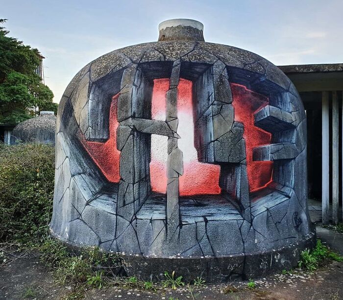 3D graffiti art on a concrete structure with cracked stone illusion and red glowing background, creative graffiti art outdoors.